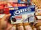 Subang Jaya, Malaysia - 28 March 2021 : Hand hold a boxed of OREO Double Creme Cookies for sell in the supermarketÂ 
